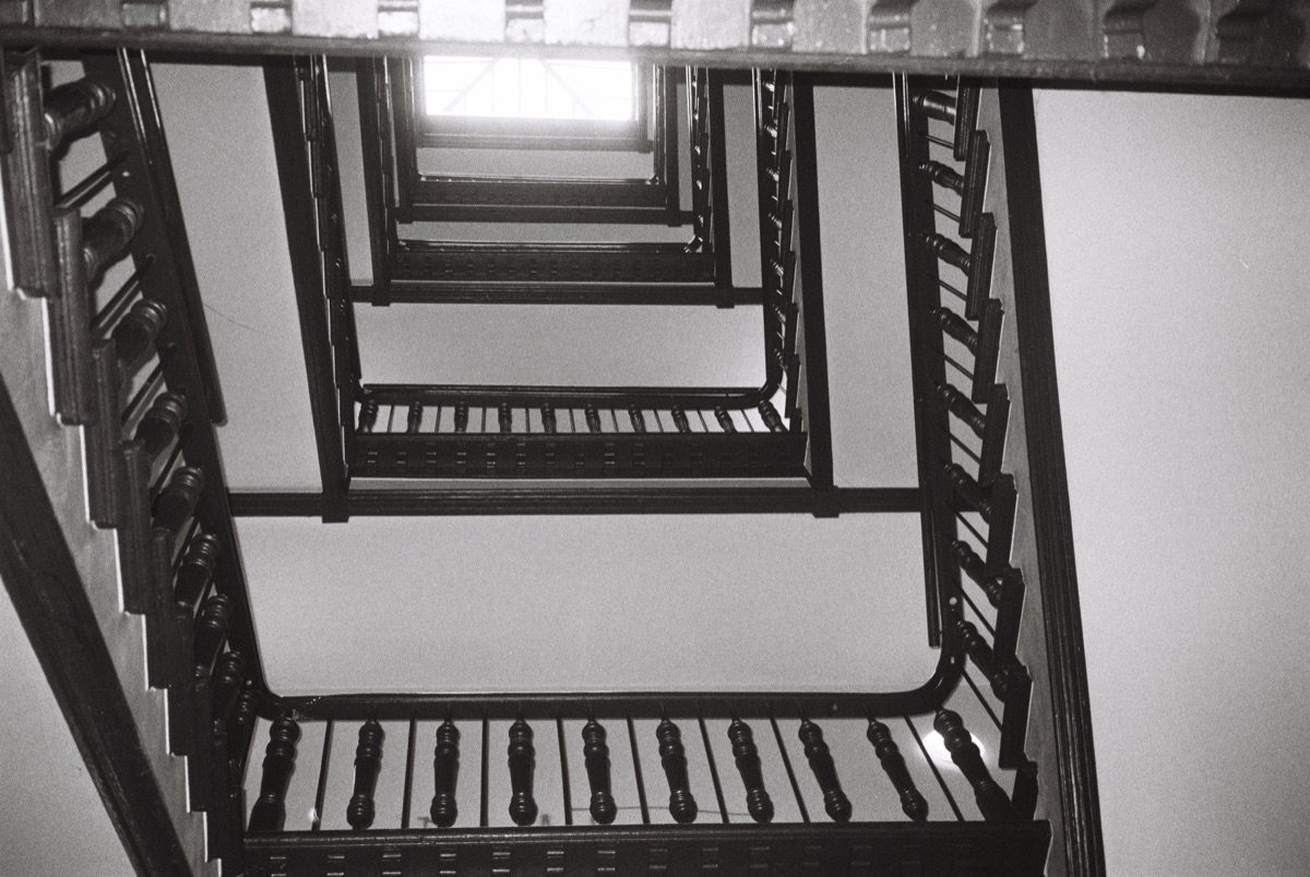 Looking up a stairwell, black and white