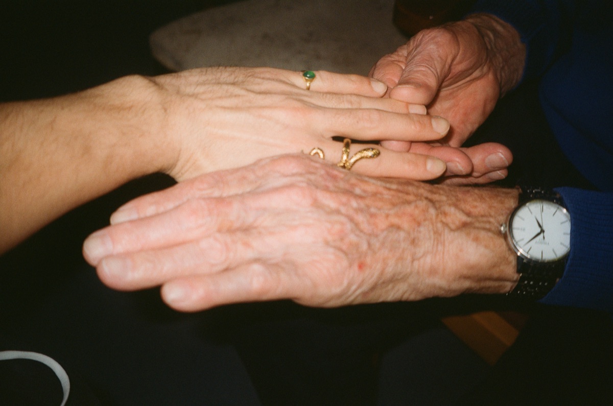 Two old hands resting on each other
