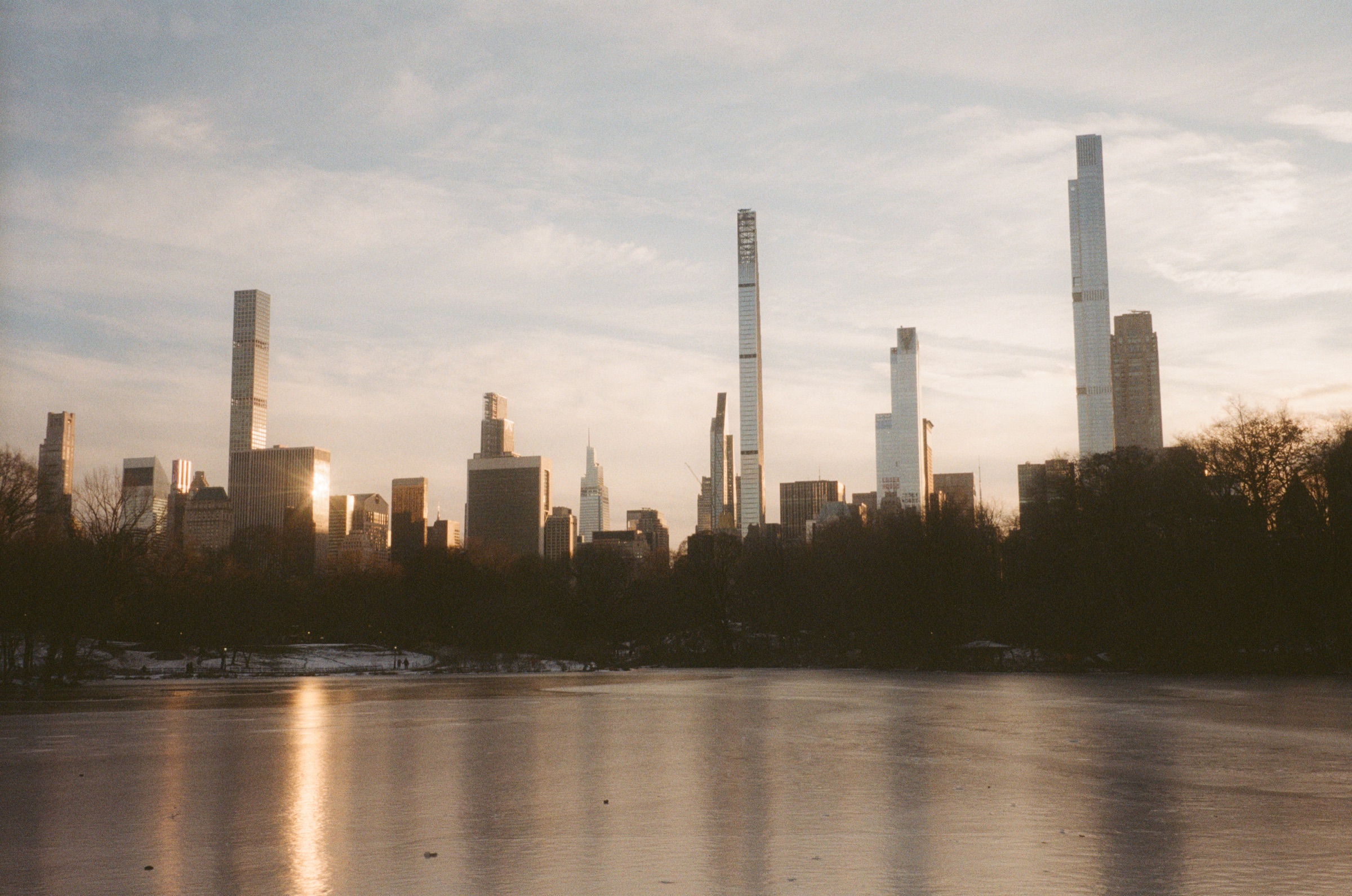 Midtown skyline over the frozen lake in Central Park